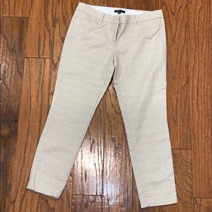 tan and white patterned trousers